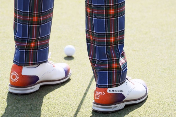 Detailed view of the shoes of Justin Thomas of the United States of America featuring a campaign for 'World NTD day' as he putts during Day One of the Abu Dhabi HSBC Championship at Abu Dhabi Golf Club on Thursday in Abu Dhabi, United Arab Emirates. (Photo by Andrew Redington)