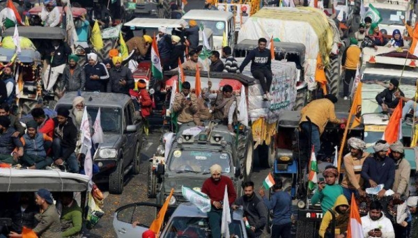 Farmers protest during a tractor rally near the Singhu border crossing in Delhi, India, on Tuesday. — Courtesy photo