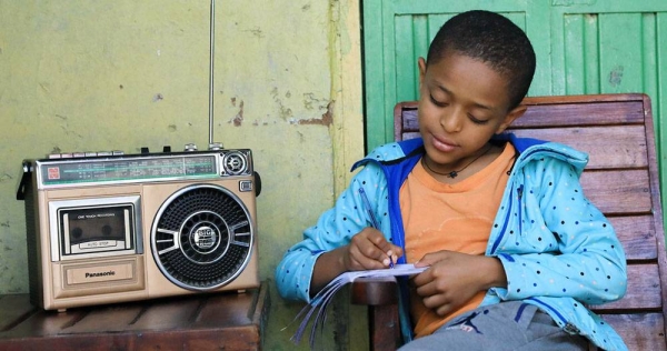 A young boy in Ethiopia attends class at home, taking lessons via the radio, which are being broadcast across the country. — courtesy UNICEF/Nahom Tesfaye