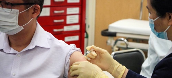 A man receives a COVID-19 vaccination in Macau, China. — courtesy Macau Photo Agency