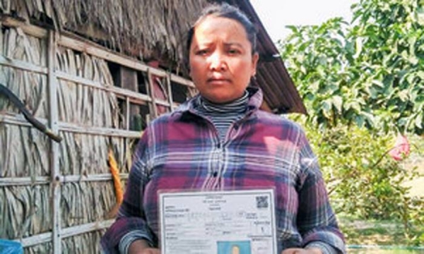 
A Cambodian woman shows her government-issued IDPoor card. — courtesy UNDP Cambodia/Kimheang Toun