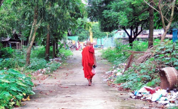 A monk walks toward a pagoda temple near Yangon, Myanmar. — courtesy Unsplash/Anika Mikkelson