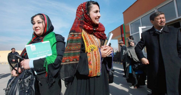 Women parliamentarians of the Afghan Lower House (Wolesi Jirga or “House of the People”) arrive at their inauguration ceremony in Kabul (2001). — courtesy UN Photo/Eric Kanalstein