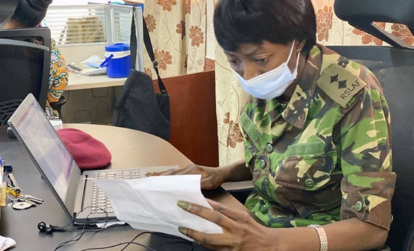 Lt. Matilda Moiwo (center) and her colleagues prepare to collecting a patient suspected of catching COVID-19. — courtesy NaCOVERC/Alpha Daramy