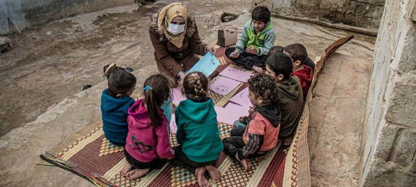 A health worker talks to displaced children about their hopes and worries in Atma camp, Syria. — Courtesy photo
