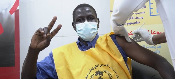 A health care worker in Sudan flashes a V for victory sign as he is vaccinated against COVID-19. — Courtesy photo
