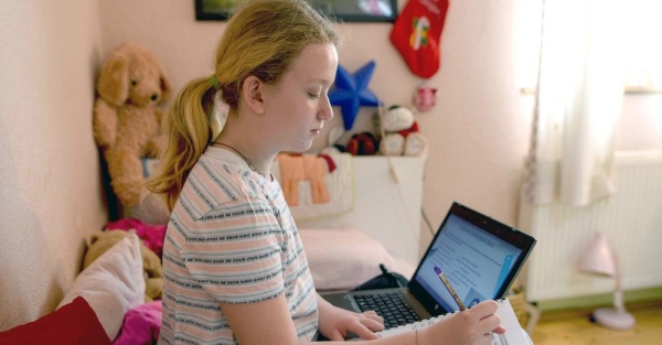 Young girls in Turkey use their digital devices. — courtesy UNICEF/Olcer