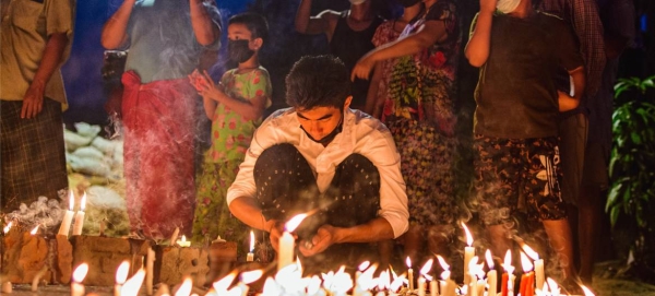 People in Yangon are seen holding a night vigil in defiance of a curfew in this file courtesy photo.