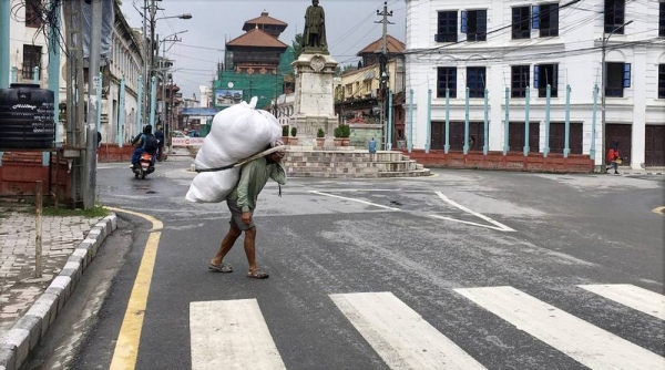 Developing countries, in particular, have been hit hard by the impacts of the coronavirus pandemic. Pictured, here a daily wage earner during the COVID-19 lockdown in Kathmandu, Nepal. — courtesy UN News Vibhu Mishra