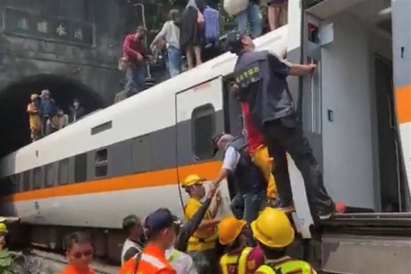 A busy passenger train carrying 490 people has derailed in a tunnel in eastern Taiwan, killing at least 51 and injuring dozens more. — Courtesy photo