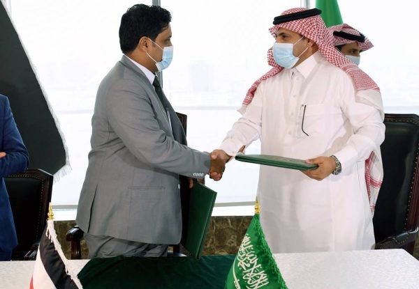 SDRPY Supervisor General Ambassador Mohammed Bin Saeed Al Jaber exchange an agreement with the Yemeni Minister of Electricity and Energy Dr. Anwar Kalashat to supply oil derivatives to operate more than 80 power stations.