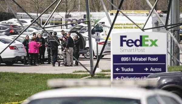 A group of crime scene investigators gather to speak in the parking lot of a FedEx SmartPost building in Indianapolis, Indiana. — courtesy photo