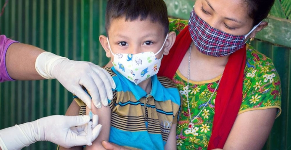 A young boy is vaccinated against measles and rubella during a national vaccination campaign in Bangladesh. — courtesy  UNICEF/Jannatul Mawa