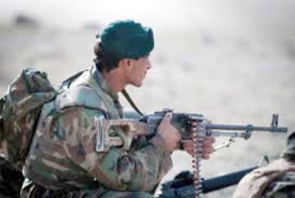 A member of the Afghan security forces is standing guard.