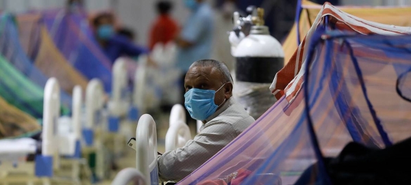 Patients receive treatment in the COVID-19 care center at the Commonwealth Games Village (CWG) in New Delhi in this file courtesy photo