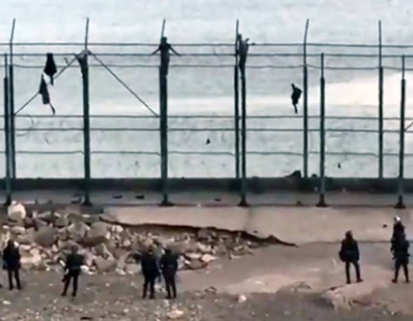 A videograb of Spanish police rounding up the migrants from Morocco, who arrived in the Spanish enclave of Ceuta between Monday and Tuesday.