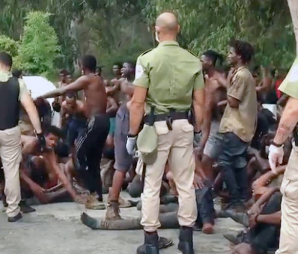 A videograb of Spanish police rounding up the migrants from Morocco, who arrived in the Spanish enclave of Ceuta between Monday and Tuesday.