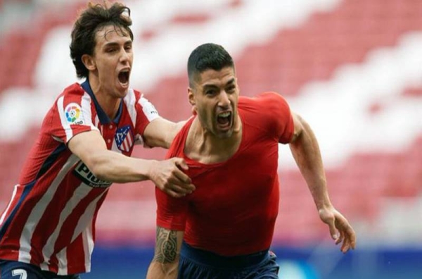 Luis Suarez earned rivals Atletico Madrid the first La Liga in seven years after holding off the title challenge of city rivals Real by coming from behind to beat Real Valladolid 2-1.