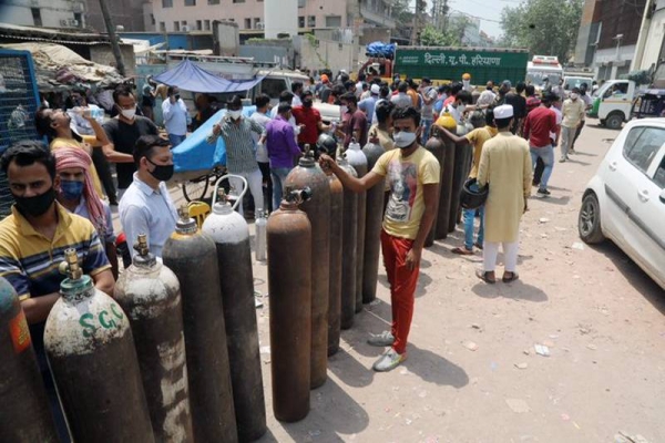  India crossed another grim milestone Monday of more than 300,000 people lost to the coronavirus as a devastating surge of new infections that exploded with fury has shown signs of easing.