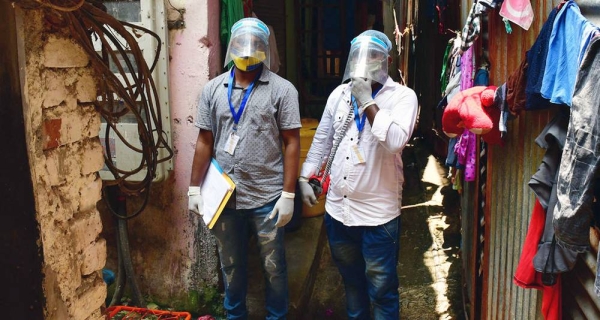 Health workers conduct a COVID-19 vaccination awareness campaign in a neighborhood in Mumbai, India. — courtesy UNICEF/Bhushan Koyande