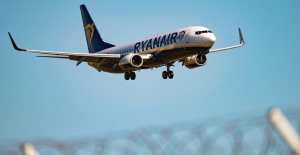 File photo of a Ryanair plane approaching an airport for landing. — courtesy Unsplash/Fotis Christopoulos