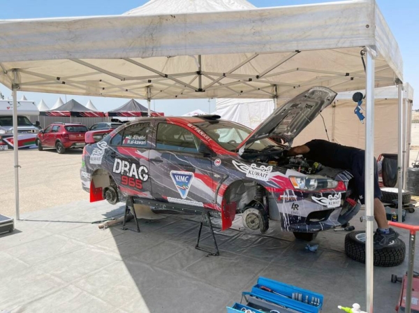 Team technicians prepare Nasser's car in Jordan.