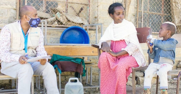 A mother who was displaced from Tigray's western zone talks to a UNICEF worker in the town of Mekelle. — courtesy UNICEF/Esiey Leul Kinfu