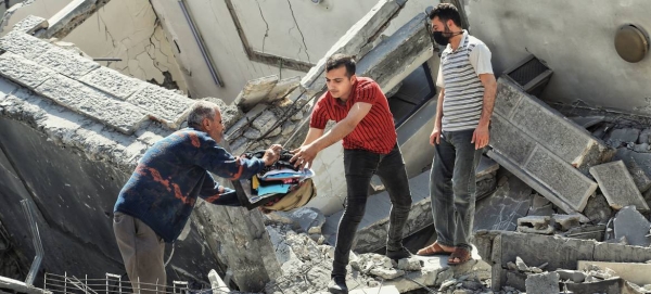 Possessions are salvaged from a damaged building in Gaza following Israeli strikes in May. — Courtesy file photo