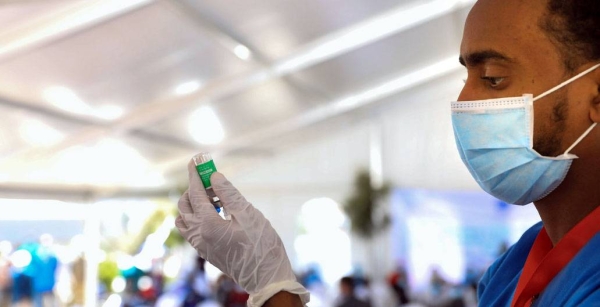 A health worker prepares a COVID-19 vaccine in Ethiopia. — courtesy UNICEF/Nahom Tesfaye