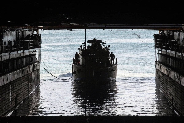 A U.S. Navy Mark VI patrol boat navigates into the well deck of dock landing ship Ashland at Naval Base Guam in this file courtesy photo.