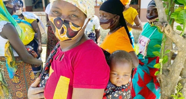 A woman and her baby who fled their home in northern Mozambique in November 2020 are now living in a camp for displaced people. — courtesy UNHCR/Juliana Ghazi