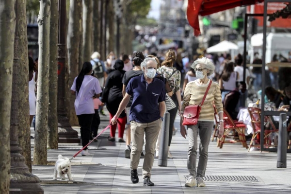 France has lifted the requirement to wear a face mask outdoors in public and will stop its nighttime curfews earlier than planned. — Courtesy file photo