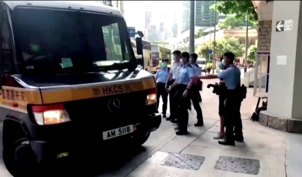 The first person to stand trial under Hong Kong's national security law pleaded not guilty Wednesday to the allegation he was inciting secession by driving a motorcycle into police officers while carrying a protest flag. Videograb of a security van entering a secure location in Hong Kong.