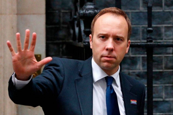 British Health Secretary Matt Hancock has apologized for breaching COVID-19 regulations after being pictured in an embrace with his adviser. — Courtesy file photo