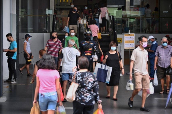 The roadmap, proposed by three members of Singapore's COVID-19 task force, would scrap lockdowns and mass contact tracing and allow for a return to quarantine-free travel and the resumption of large gatherings. It would even stop counting the daily coronavirus cases. — Courtesy file photo