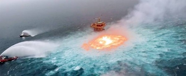 A videograb shows numerous vessels dousing the flames after fire broke out in the southern waters of the Gulf of Mexico on Friday after an underwater pipeline leaked, literally setting the “ocean on fire”.
