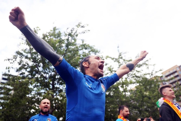 Italy's Federico Chiesa celebrates his side's first goal after he curled a beautiful strike into the far corner of Unai Simon's net.