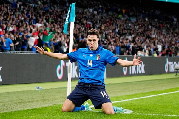 Italy's Federico Chiesa celebrates his side's first goal after he curled a beautiful strike into the far corner of Unai Simon's net.