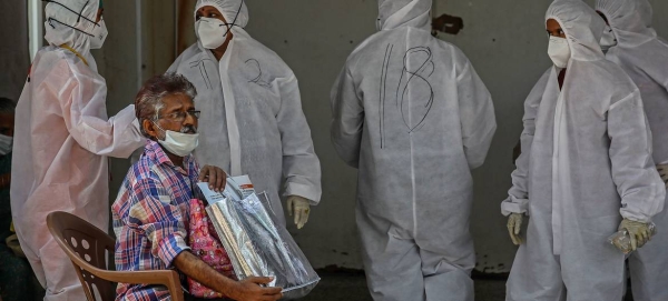 A man waits to be tested for Covid outside a hospital in Mumbai, India, in this file courtesy photo.
