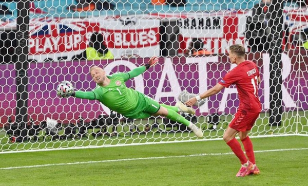 Denmark goalkeeper Kasper Schmeichel saves a super close range shot from England's Mount to keep the Danes in the hunt for Euro 2020 final spot at Wembley on Wednesday. His heroics however, could not stop England from advancing.