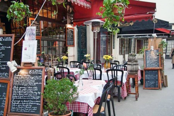 A file photo of a Paris restaurant. France has moved to restrict restaurants, cafes and shopping centers to those that have been vaccinated or who have recently tested negative for COVID-19.