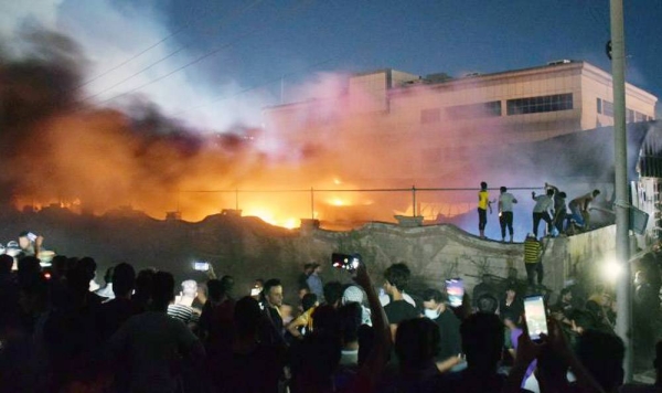 A videograb of smoke rising after fire broke out in a COVID-19 isolation ward of Al-Hussein Hospital in Nasiriya city in Dhi Qar governorate, Iraq, on Tuesday.
