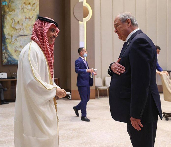 Saudi Arabia’s Foreign Minister Prince Faisal Bin Farhan, left, is seen with President of Uzbekistan Shavkat Mirziyoyev in Tashkent on Friday. 