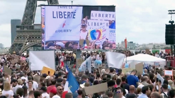 French lawmakers approved an extension of the COVID health pass requirements to bars and restaurants in the early hours of Monday as tens of thousands of people demonstrated across France against the extension of the health pass and compulsory vaccination for certain professions.