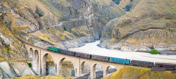 A locomotive freight train traverses the Absirom Bridge on the Trans-Iranian Railway in Iran. — courtesy UNESCO/Hossein Javadi