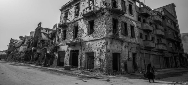 Young boys stand in front of a destroyed building in Benghazi Old Town in Libya. — Courtesy file photos
