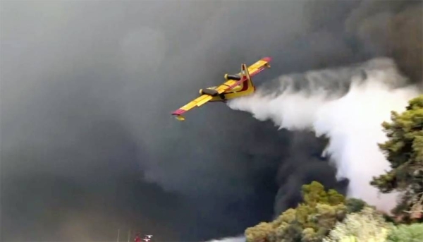 An aerial photo shows wildfires in Kacarlar village near the Mediterranean coastal town of Manavgat, Antalya, Turkey, Saturday.