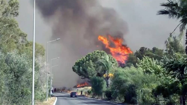 An aerial photo shows wildfires in Kacarlar village near the Mediterranean coastal town of Manavgat, Antalya, Turkey, Saturday.