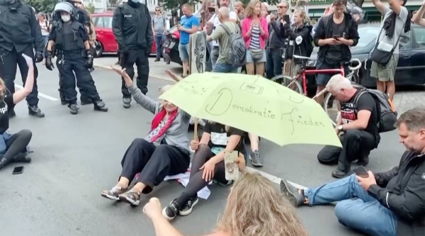 Berlin Police break up the protests in various neighborhoods of the capital with 600 peopledetained during the demonstrations, which saw outbursts of violence as protesters defied orders to disperse and tried to break through police lines.