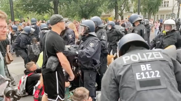Berlin Police break up the protests in various neighborhoods of the capital with 600 peopledetained during the demonstrations, which saw outbursts of violence as protesters defied orders to disperse and tried to break through police lines.
